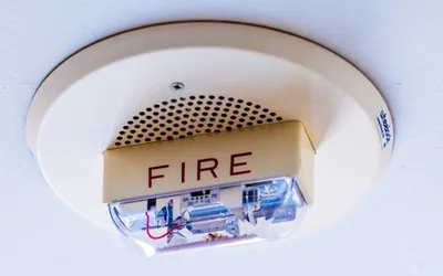 A ceiling-mounted fire detector