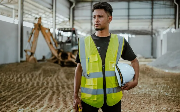 A worker alone in an industrial hall